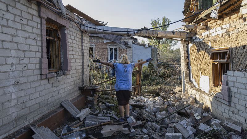 Olena Kononenko, 61 reacts near her damaged house after Russian rocket attack in Kostiantynivka, Donetsk region, Ukraine, on Wednesday, Sept. 27, 2023.