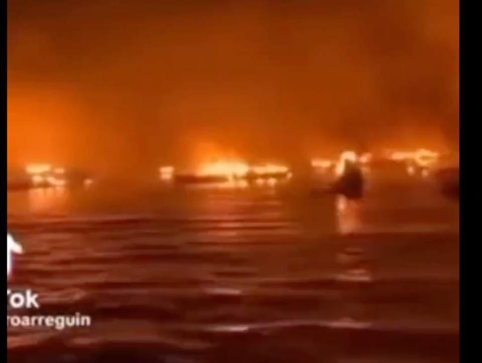 Footage of boats in fire, claiming to be from the Hawaii wildfires this week, have circulated online (Twitter / The Paradox Files)