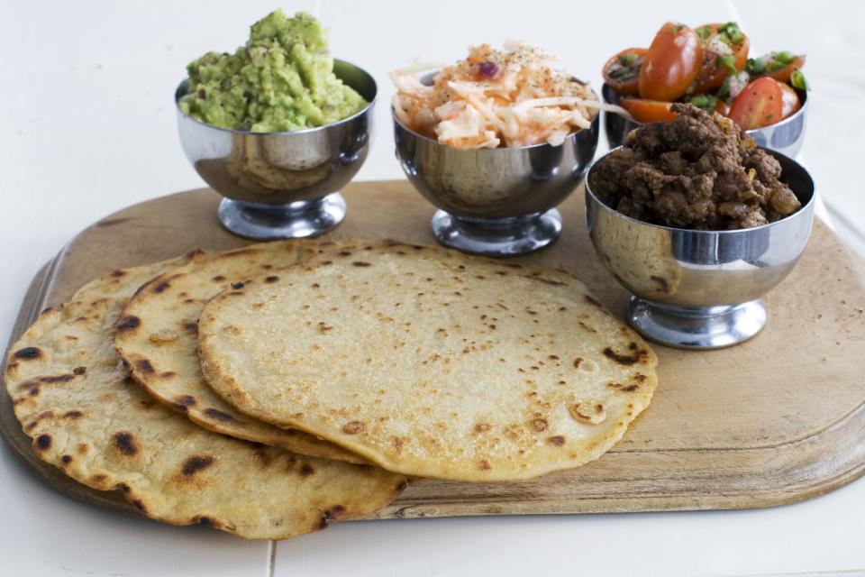 In this image taken on March 4, 2013, tortillas with tomato-mint salsa and guacamole are shown in Concord, N.H. (AP Photo/Matthew Mead)