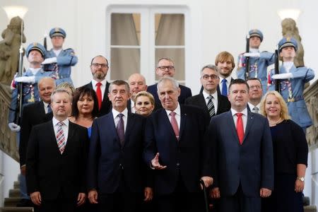 Czech President Milos Zeman and Prime Minister Andrej Babis pose for a group photograph with newly appointed members of the Czech government during the cabinet's inauguration at Prague Castle in Prague, Czech Republic June 27, 2018. REUTERS/David W Cerny