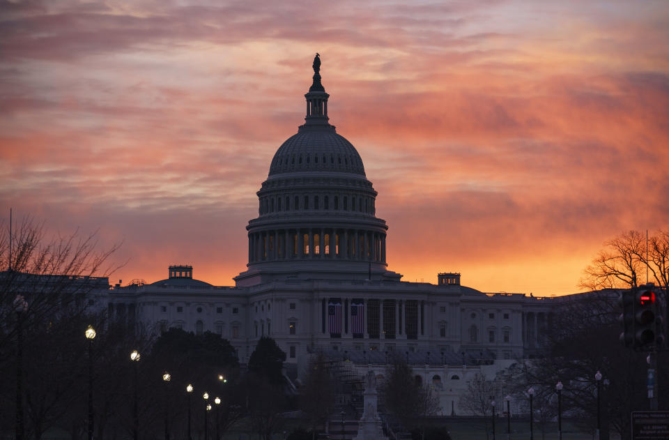 Dawn breaks at the Capitol in Washington, Monday, Jan. 11, 2021. House Speaker Nancy Pelosi, D-Calif., is calling for congressional action to rein in President Donald Trump after inciting last week's deadly assault on the U.S. Capitol. (AP Photo/J. Scott Applewhite)