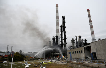 Firefighters spray water at a refinery after a fire broke out following an explosion in Vohburg near Ingolstadt, Germany, September 1, 2018. REUTERS/Andreas Gebert