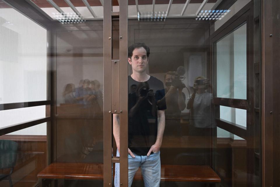 US journalist Evan Gershkovich, arrested on espionage charges, stands inside a defendants' cage before a hearing to consider an appeal on his extended detention at The Moscow City Court  in Moscow on June 22, 2023.