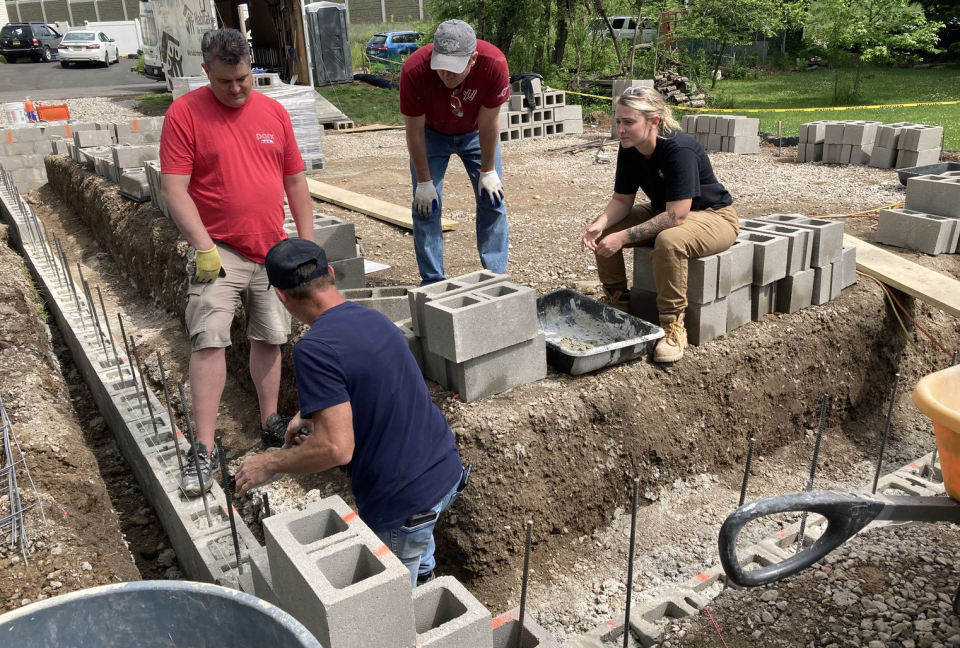 Volunteers with Habitat for Humanity and Parx Casino begin to lay the foundations for a new home on Beaver Dam Road in Bristol Township