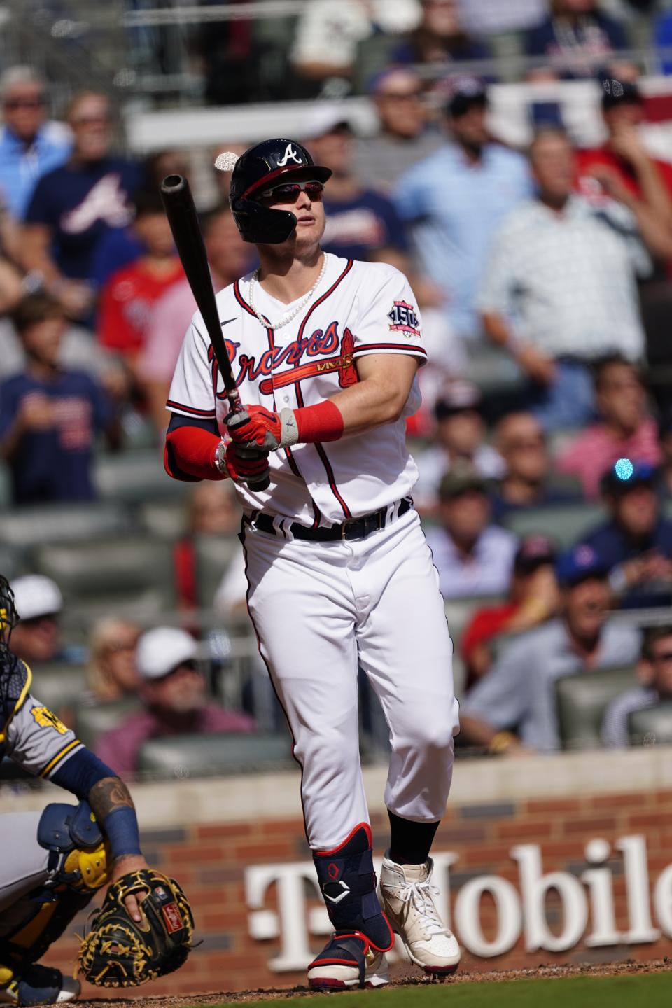 Atlanta Braves' Joc Pederson (22) follows through on his three-run homer against the Milwaukee Brewers during the fifth inning of Game 3 of a baseball National League Division Series, Monday, Oct. 11, 2021, in Atlanta. (AP Photo/John Bazemore)