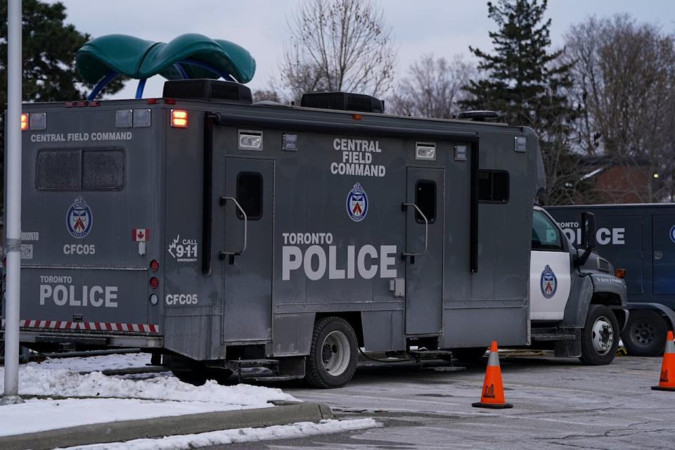 A Toronto Police command truck is pictured on Driftwood Avenue in Toronto, Sunday, Feb. 18, 2024. Police have made no arrests after a pair of shootings at a bus stop 21 hours apart which left a man dead and a teenager with serious injuries and are still trying to determine how many suspects may be involved, but Wehby says investigators have located a black Acura RDX believed to be linked to both shootings. 