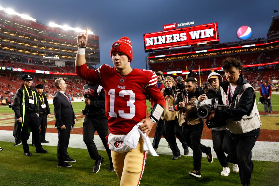 San Francisco 49ers quarterback Brock Purdy (13) celebrates after an NFL wild card playoff football game against the Seattle Seahawks in Santa Clara, Calif., Saturday, Jan. 14, 2023. The 49ers won 41-23. (AP Photo/Jed Jacobsohn)