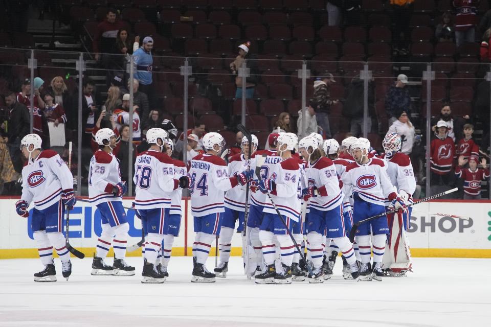 Montreal Canadiens goaltender Sam Montembeault (35) celebrates after an NHL hockey game against the New Jersey Devils Tuesday, Feb. 21, 2023, in Newark, N.J. The Canadiens won 5-2. (AP Photo/Frank Franklin II)