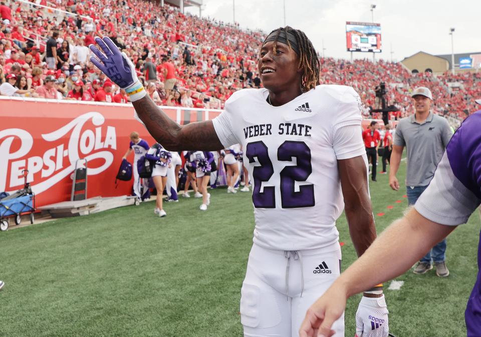 Weber State Wildcats wide receiver Rashid Shaheed waves to the crowd after scoring on a kickoff return during the season opener against the Utes at Rice-Eccles Stadium in Salt Lake City on Thursday, Sept. 2, 2021. | Jeffrey D. Allred, Deseret News