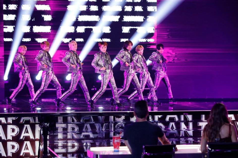 Japanese boy band Travis Japan performed stunning dance moves in shimmering silver ensembles.