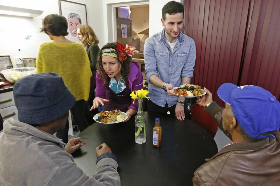 Hannah Style and fellow volunteers serve food to residents at Conway House (Nigel Howard)