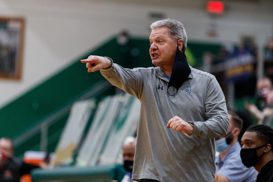 Saint Joseph head coach Mark Johnson directs his team during a 3A regional semifinal  against Twin Lakes in this 2021 file photo at Washington High School in South Bend