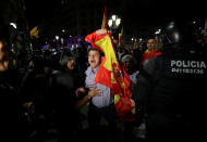 <p>A pro unity demonstrator is stopped by Catalan Regional Police officer during a protest after the Catalan regional parliament declared independence from Spain in Barcelona, Spain, Oct. 27, 2017. (Photo: Albert Gea/Reuters) </p>