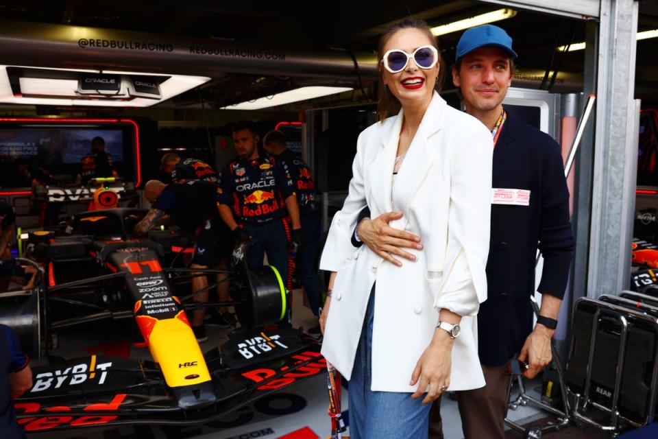 Maria Sharapova and Alexander Gilkes pose for a photo next to the car of Sergio Perez of Mexico and Oracle Red Bull Racing in the garage during the F1 Grand Prix of Monaco at Circuit de Monaco (Getty Images)