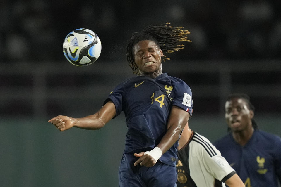 France's Fode Sylla heads the ball during the U-17 World Cup final soccer match between Germany and France at Manahan Stadium in Surakarta, Indonesia, Saturday, Dec. 2, 2023. (AP Photo/Achmad Ibrahim)