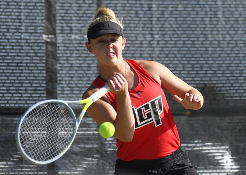 Lubbock-Cooper's Gracie Wood hits the ball in the District 4-5A tennis tournament Wednesday, March 29, 2023, at Lubbock-Cooper High School in Woodrow.
