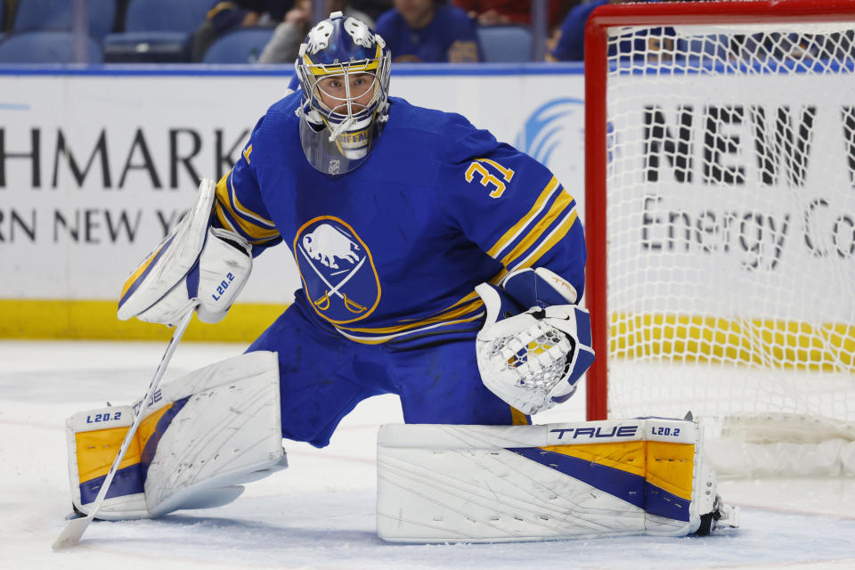Buffalo Sabres goaltender Eric Comrie (31) slides across the crease during the second period of an NHL hockey game against the Arizona Coyotes, Tuesday, Nov. 8, 2022, in Buffalo, N.Y. (AP Photo/Jeffrey T. Barnes)