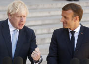 French President Emmanuel Macron, right, and Britain's Prime Minister Boris Johnson talk to the media at the Elysee Palace, Thursday, Aug. 22, 2019 in Paris. Boris Johnson traveled to Berlin Wednesday to meet with Chancellor Angela Merkel before heading to Paris to meet with French President Emmanuel Macron. (AP Photo/Michel Spingler)