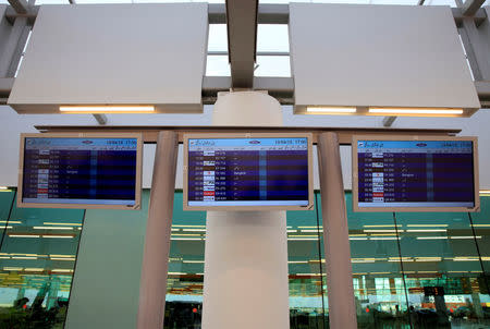 Flight schedule monitors are pictured a during media tour of the newly built Islamabad International Airport, ahead of its official opening, Pakistan April 18, 2018. REUTERS/Faisal Mahmood