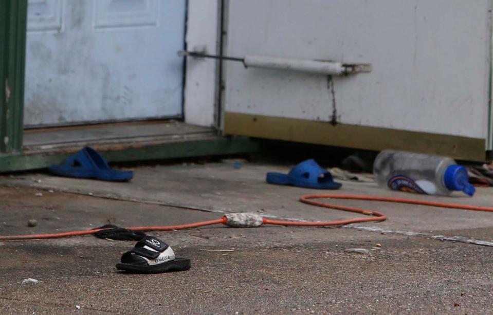 Slippers outside 197 Dayton Place in Akron on Friday, Akron Police say preliminary findings suggest that Kismet Sengdan, 10, was accidentally shot and killed when juveniles found an unsecured firearm belonging to an adult living in this home on Thursday. Police recovered the handgun.