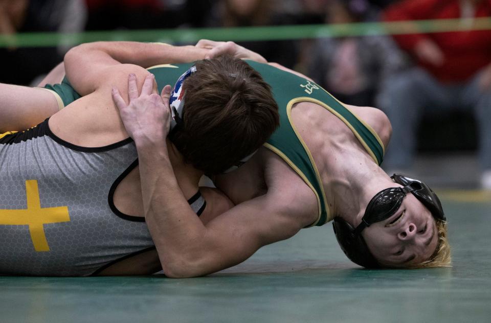 St. John Vianney's Cole Stangle (nearest the camera) puts Brick Memorial's Braden Scott on his back during his 12-6 win at 144 pounds Thursday night in the Lancers' 40-31 win in a Shore Conference Tournament quarterfinal-round match.