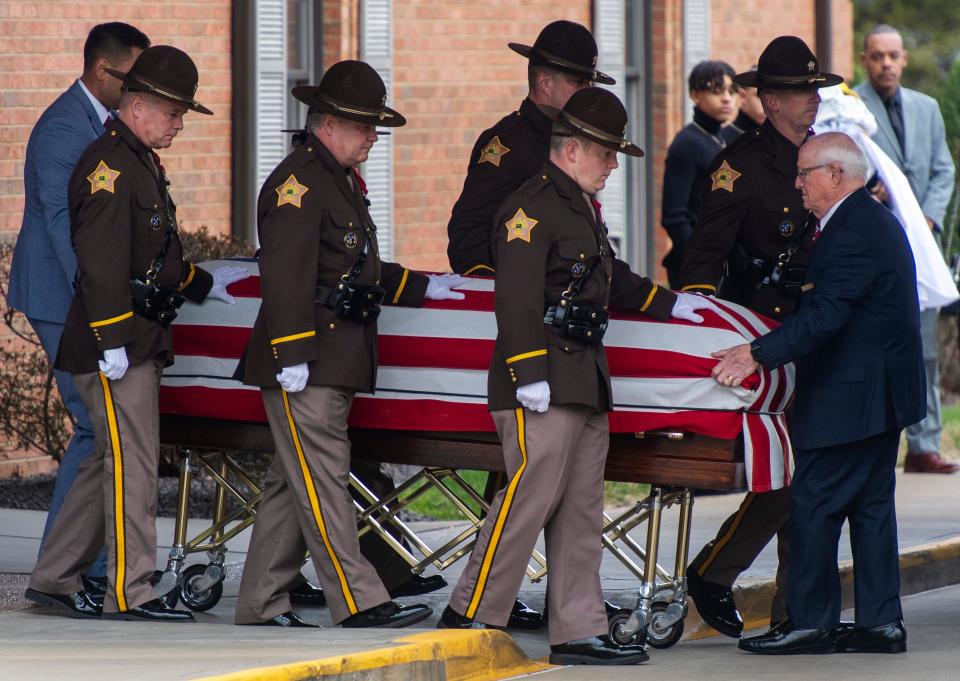 The casket for fallen Vanderburgh County Sheriff's Deputy Asson Anthony Hacker is escorted to a hearse outside Boone Funeral Home before the procession moves through the streets of Evansville to Christian Fellowship Church for his visitation and funeral Thursday morning, March 9, 2023. Hacker was going through training March 2 when he became ill, lost consciousness and died, according to Sheriff Noah Robinson.