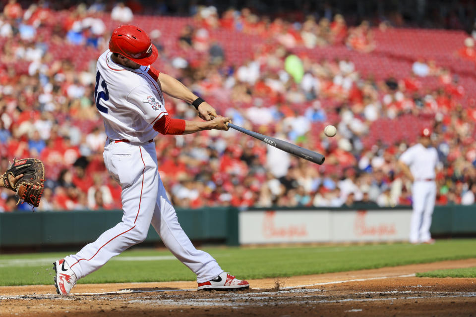 Cincinnati Reds' Wil Myers hits a solo home run during the second inning of a baseball game against the Philadelphia Phillies in Cincinnati, Saturday, April 15, 2023. (AP Photo/Aaron Doster)