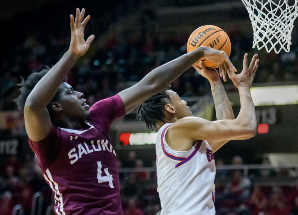 Bradley's Zek Montgomery, right, moves to the basket around SIU's Clarence Rupert in the second half Wednesday, Feb. 1, 2023 at Carver Arena.