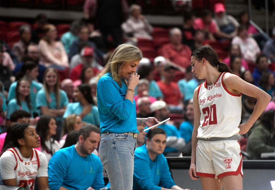 Texas Tech head coach Krista Gerlich speaks with Texas Tech guard Bailey Maupin (20) during the Big 12 basketball game against Oklahoma State, Wednesday, Feb. 14, 2024, at United Supermarkets Arena.