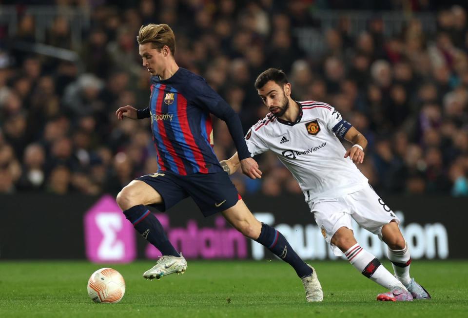 Frenkie de Jong in action against Bruno Fernandes  (PA)