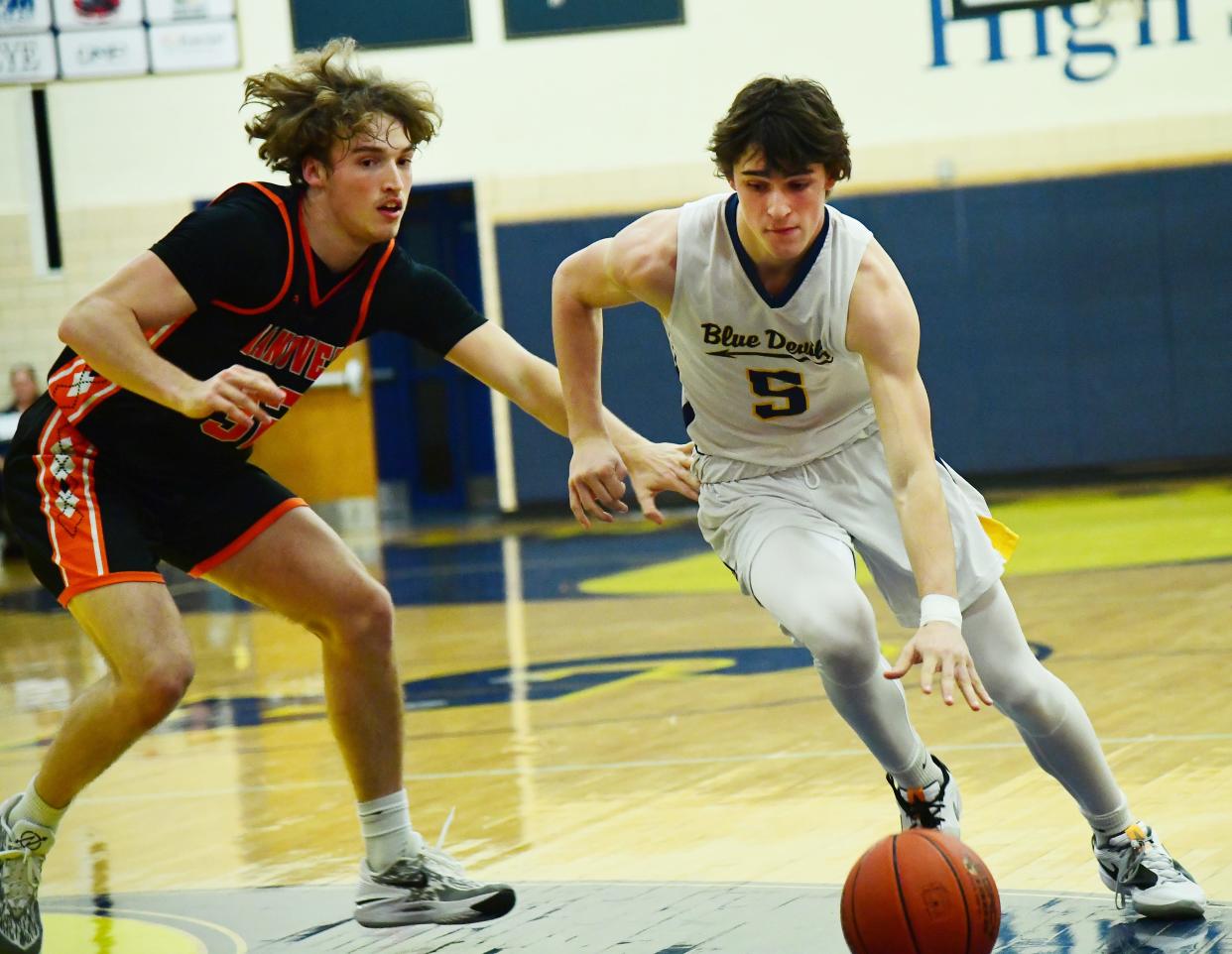 Carter McCauley of Greencastle drives to the basket against Hanover's Ethan Herndon. Greencastle defeated Hanover, 55-47, during the Greencastle-Antrim Tip-Off Tournament on Friday, December 1, 2023.