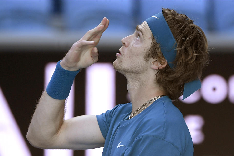 Russia's Andrey Rublev celebrates after defeating Spain's Feliciano Lopez in their third round match at the Australian Open tennis championship in Melbourne, Australia, Saturday, Feb. 13, 2021.(AP Photo/Andy Brownbill)