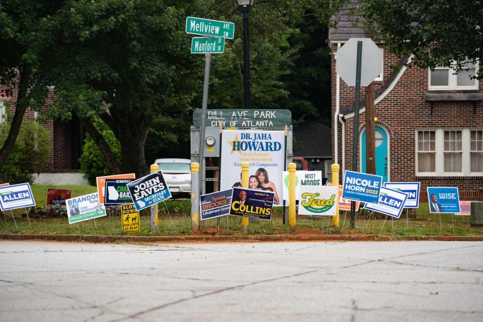 Yard signs for candidates running in Georgia's primary election on May 24, 2022, fill up a neighborhood park in Atlanta, Georgia.