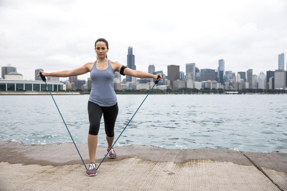 Resistance bands are an easy way to tone muscle without access to a gym. (Image via Getty Images)