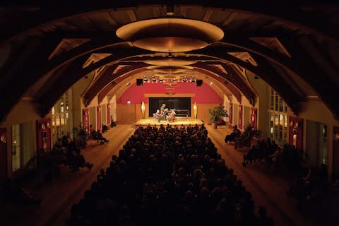 The resort's timber-framed auditorium - Credit: Schloss Elmau