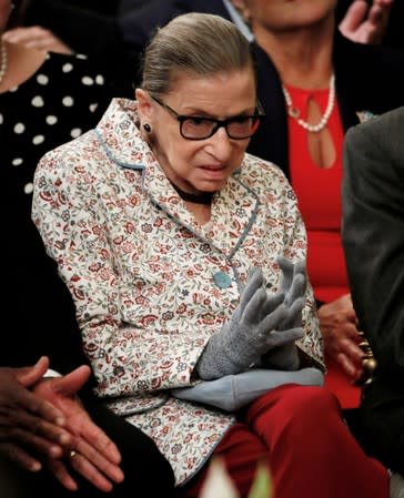 FILE PHOTO: U.S. Supreme Court Associate Justice Ginsburg applauds as new Justice Kavanaugh says he has hired all female clerks at the White House in Washington