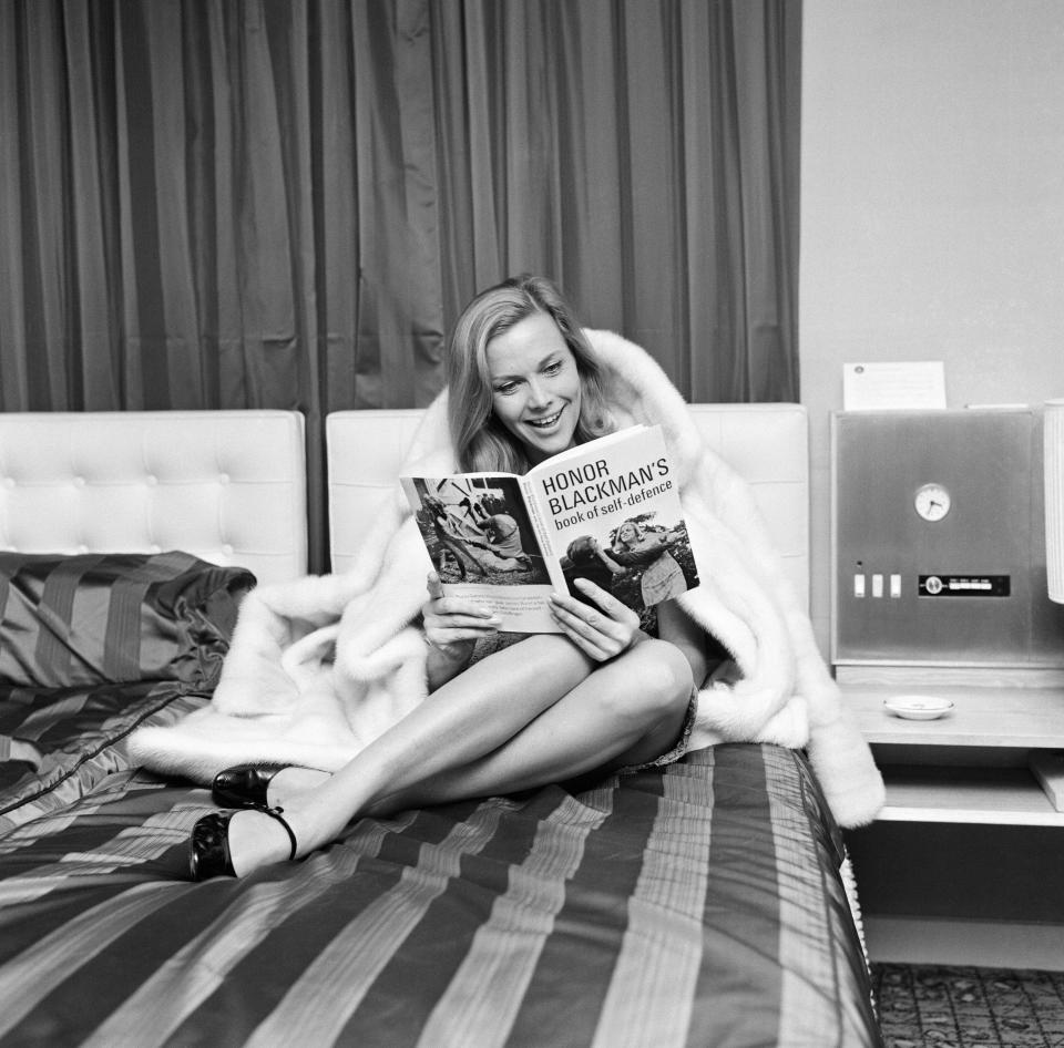 Honor Blackman, actress, in Manchester to launch her book on self defence, inspired by her success as judo expert Cathy Gale in TV series The Avengers, pictured in her suite, the Piccadilly Hotel, Manchester, Monday 22nd November 1965. Book Titled, Honor Blackman's Book of Self-Defence. (Photo by Dennis Hussey/Mirrorpix/Getty Images)