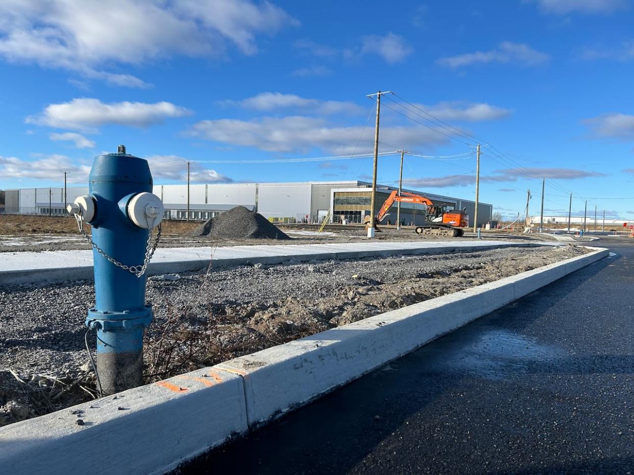 The fulfillment centre is still under construction in Vaudreuil-Dorion. The land is owned by the real-estate development firm, Harden. Walmart rents the land. (Rowan Kennedy/CBC - image credit)
