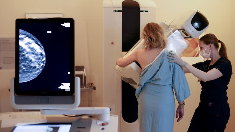 Registered radiologic technologist Holly Speer performs a mammogram on Heather Simonsen at the Huntsman Cancer Hospital in Salt Lake City on April 7, 2023.