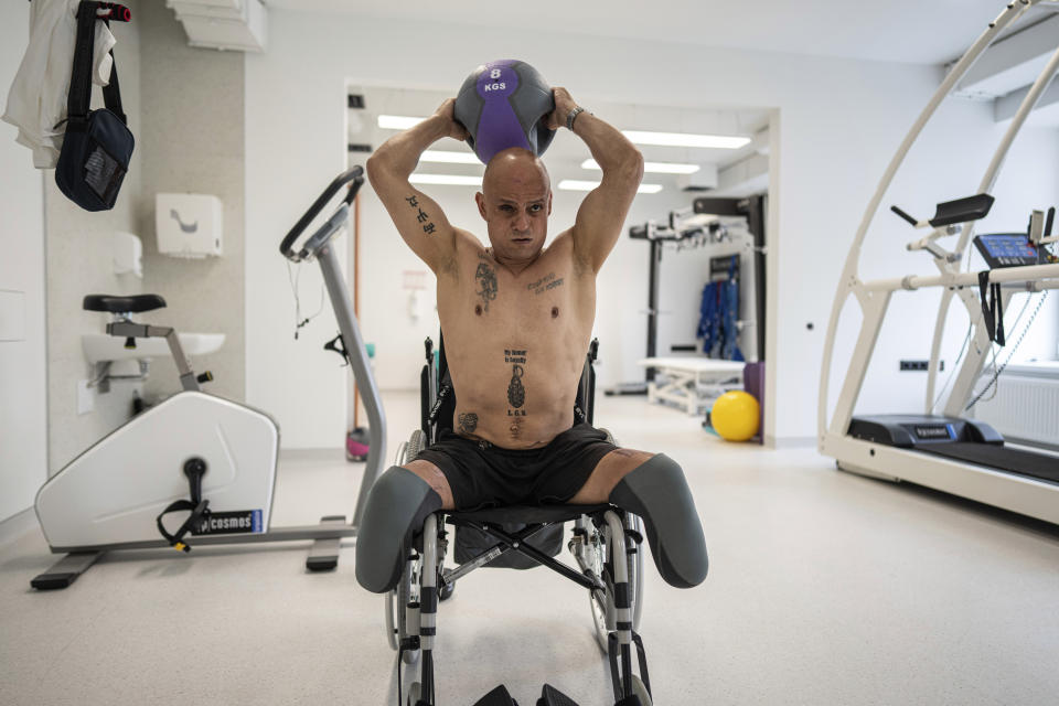 Hennadiy Techyna, a Ukrainian servicemen from the international legion, exercises at the Superhumans rehabilitation center in Vynnyky, Ukraine, Thursday, July 20, 2023. Ukraine is facing the prospect of a future with upwards of 20,000 amputees, many of them soldiers who are also suffering psychological trauma from their time at the front. (AP Photo/Evgeniy Maloletka)