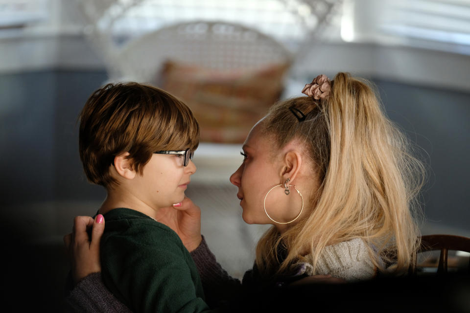 This image released by Apple shows Ryder Allen, left, and Juno Temple in a scene from “Palmer.” (Apple via AP)