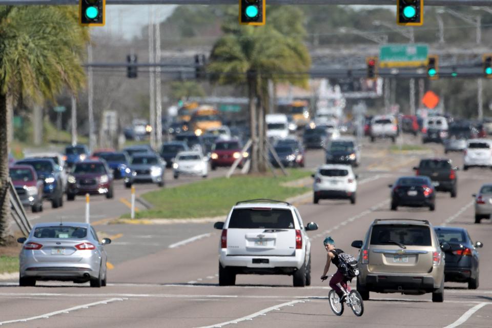 A bicyclist cuts across Beach Boulevard near Grove Park Boulevard in this 2020 photo underscoring hazards for travelers not in automobiles.