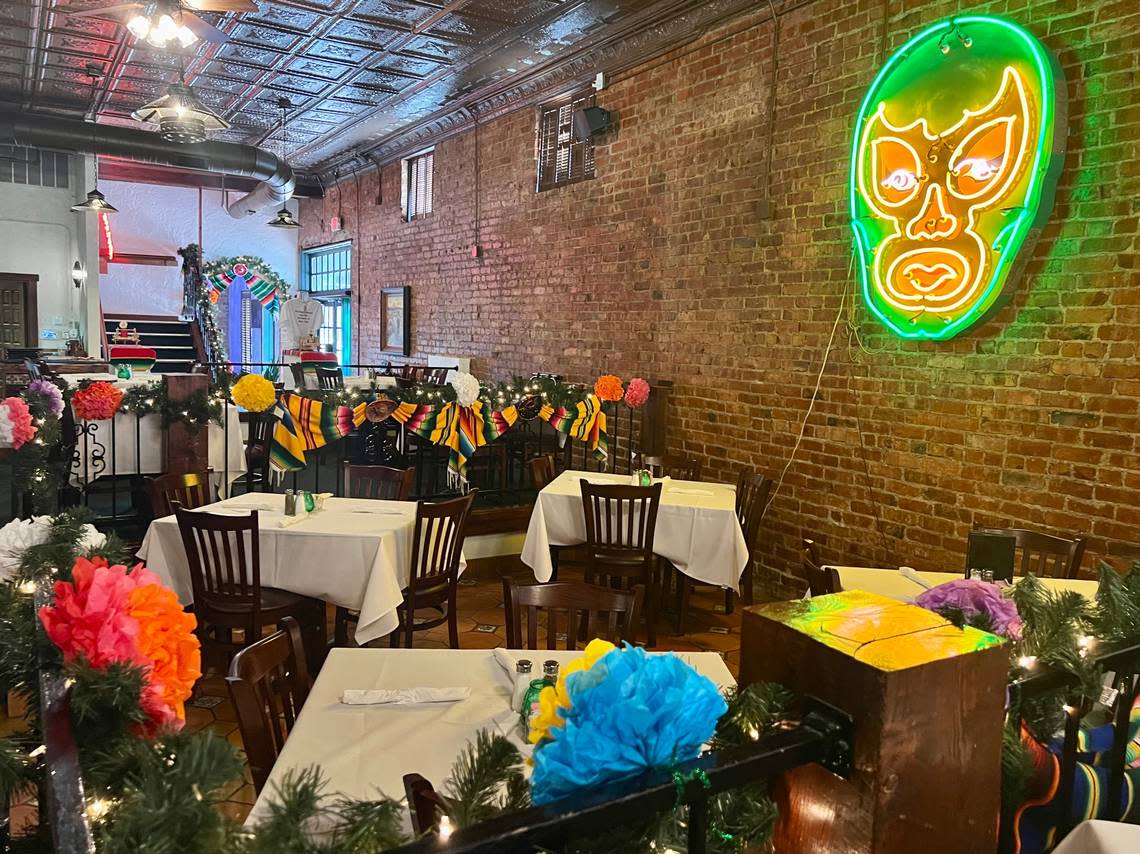 A mascara (a wrestling mask) is a feature in the colorful dining room at The Original on North Main Street.