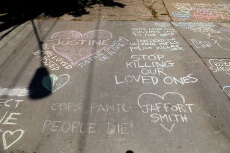 Memorials on the alleyway for Justine Damond who was shot by a Minneapolis police officer in Minneapolis, Minnesota, U.S., July 17, 2017. REUTERS/Adam Bettcher