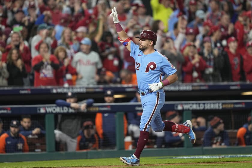 Philadelphia Phillies' Kyle Schwarber celebrates his home run during the first inning in Game 5 of baseball's World Series.