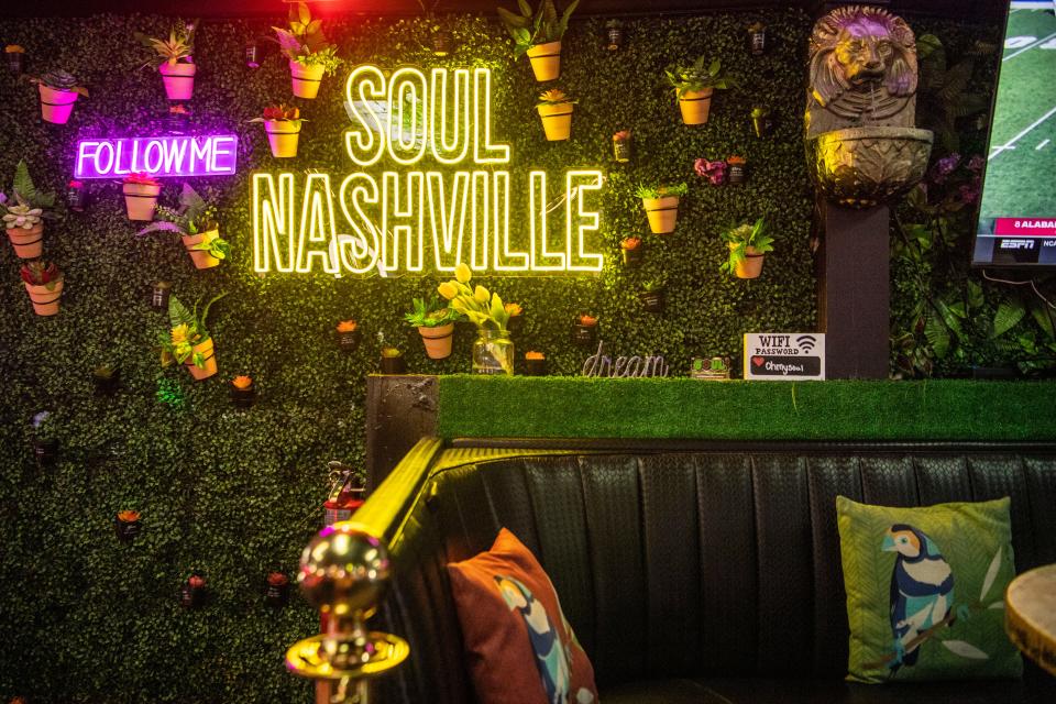 Neon lights with faux plants and flowers are displayed around the Soul Nashville in West Nashville, Tenn., Saturday, Nov. 11, 2023.