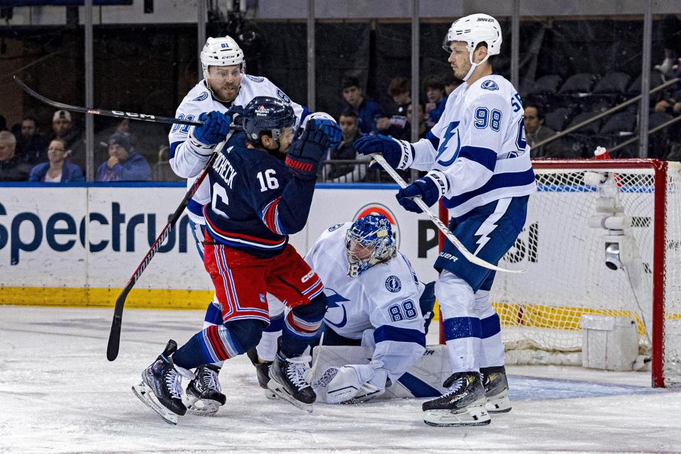 Tampa Bay Lightning defenseman Erik Cernak (81) checks New York Rangers center Vincent Trocheck (16) in front of goal during the first period of an NHL hockey game on Wednesday, Feb. 7, 2024 in New York. (AP Photo/Peter K. Afriyie)