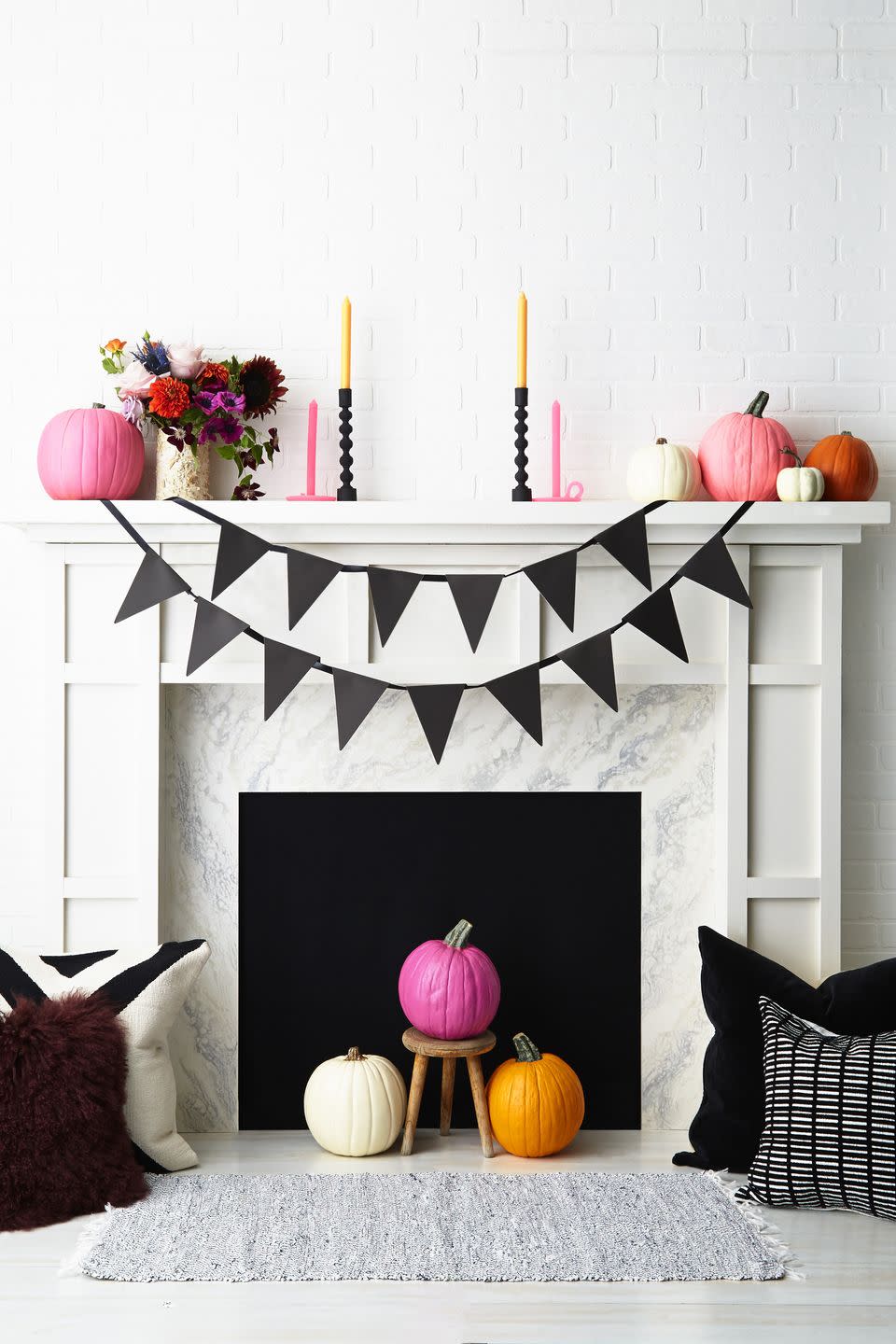 <p>DIY a festive banner by cutting pennants out of <a href="https://www.amazon.com/Darice-GX220002-Coordination-Cardstock-11-Inch/dp/B008734L34?tag=syn-yahoo-20&ascsubtag=%5Bartid%7C10055.g.1566%5Bsrc%7Cyahoo-us" rel="nofollow noopener" target="_blank" data-ylk="slk:thick construction paper;elm:context_link;itc:0;sec:content-canvas" class="link ">thick construction paper</a>, spelling out your message, and tucking ribbon ends under heavy gourds or bouquets.</p><p><a class="link " href="https://www.amazon.com/LaRibbons-inch-Double-Satin-Ribbon/dp/B01HXCF8EA?tag=syn-yahoo-20&ascsubtag=%5Bartid%7C10055.g.1566%5Bsrc%7Cyahoo-us" rel="nofollow noopener" target="_blank" data-ylk="slk:SHOP BLACK RIBBON;elm:context_link;itc:0;sec:content-canvas">SHOP BLACK RIBBON</a><br></p>