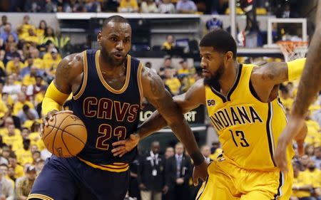 Apr 20, 2017; Indianapolis, IN, USA; Cleveland Cavaliers forward LeBron James (23) drives to the basket against Indiana Pacers forward Paul George (13) in game three of the first round of the 2017 NBA Playoffs at Bankers Life Fieldhouse. Cleveland defeats Indiana 119-114. Mandatory Credit: Brian Spurlock-USA TODAY Sports