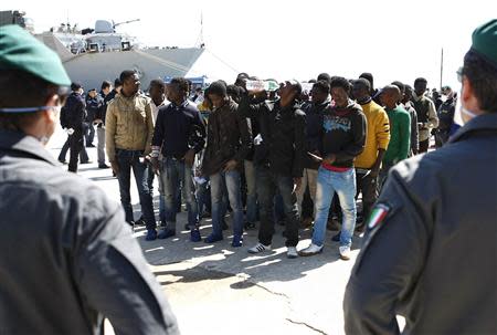Migrants arrive at the Sicilian port of Augusta near Siracusa March 21, 2014. REUTERS/Antonio Parrinello